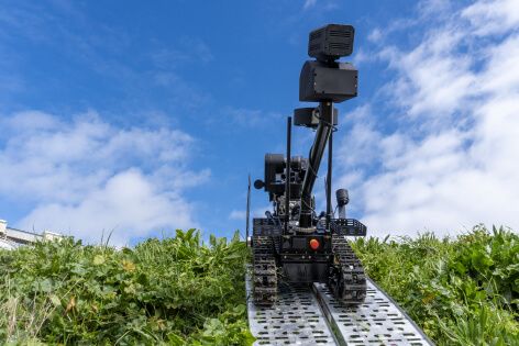 Atrax ascending a metal ramp, its flippers enabling secure movement on challenging inclines.