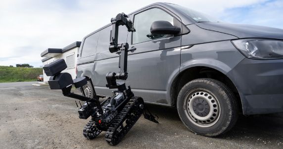 Atrax robot inspecting a suspicious package, highlighting its modular capabilities