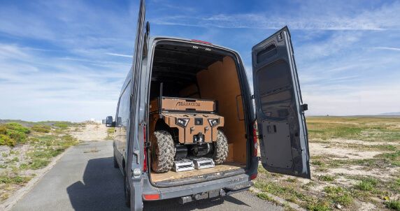 Barakuda robot stored in a Volkswagen Crafter van, showing easy transportability.