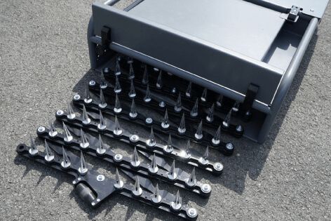 Underside view showing the Shark Spike’s rows of spikes as the device begins deployment.